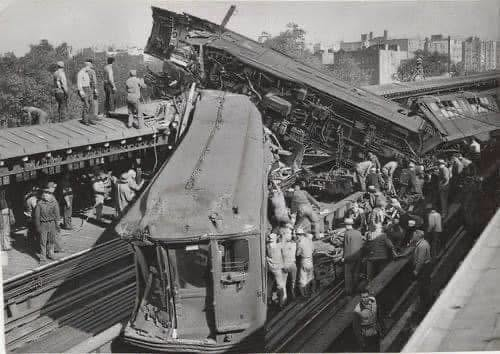 Crime_In_NYC's tweet photo. This shows the aftermath of the IRT 4 train crash at the Mosholu Parkway Station in The Bronx.

The accident took place on October 23, 1952, when one train rammed into a stopped train at full speed.

The impact caused the trains to completely detach from their axles.

Following the accident, emergency brakes were implemented on NYC subway tracks to prevent similar collisions.