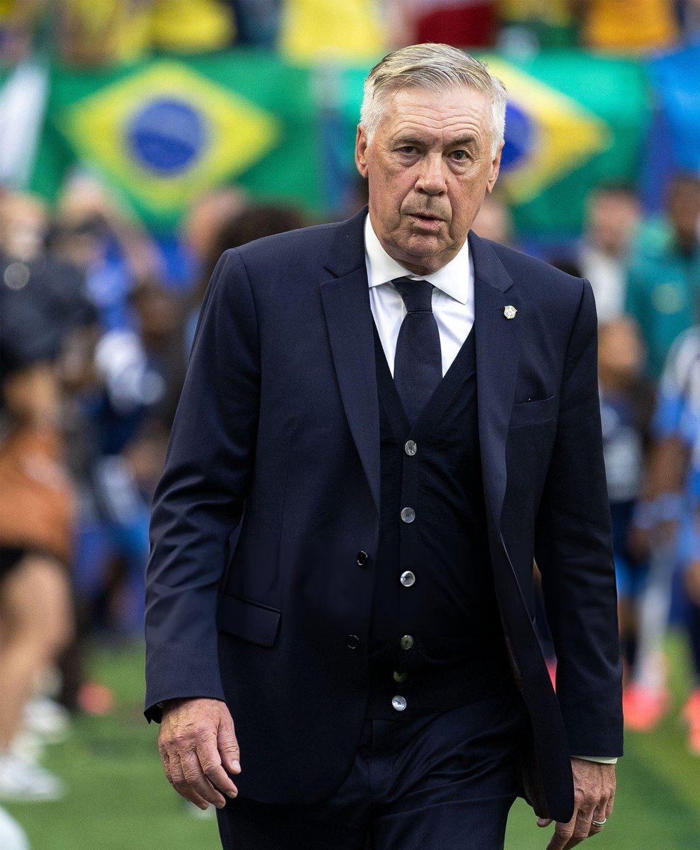 TrollFootball2's tweet photo. Carlo Ancelotti wearing 3 piece suit in Miami heat is the performance of the World Cup. https://t.co/f9m6eo5LDc