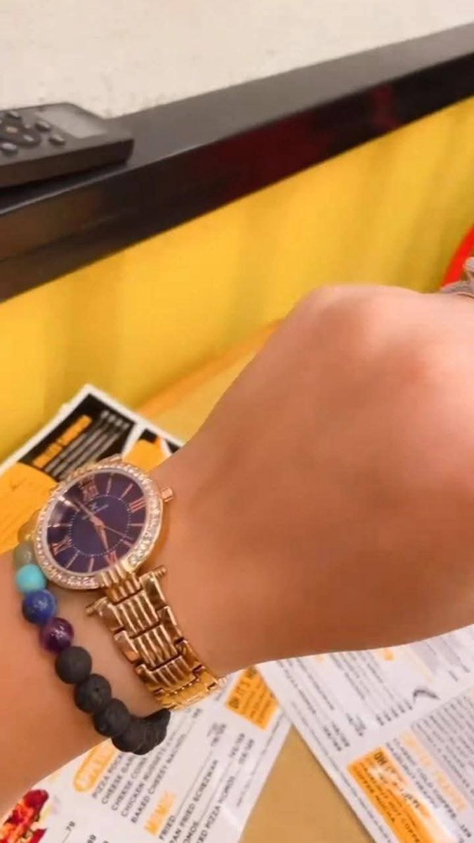 ItsMe_2026X's tweet photo. 💎 Golden Hour Glow on my wrist & nails.
This luxe gold watch with the deep purple dial & diamond bezel is my everyday statement piece. Paired with my healing beaded bracelet, bold cherry red nails (with that glitter pop 💅), and my sparkle ring — feeling like pure luxury.
Even the little battle marks can’t dim this shine 
Unstoppable vibes only.