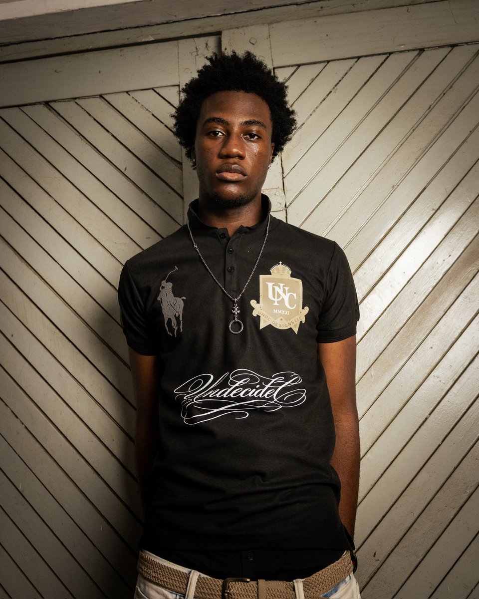 undcfashion's tweet photo. The Monochrome Polo by UNDC Fashion — clean silhouette, considered graphic language. Available now at https://t.co/HQaYpNdgnL. #UNDCFashion #SS26 https://t.co/glq3PHgiNO