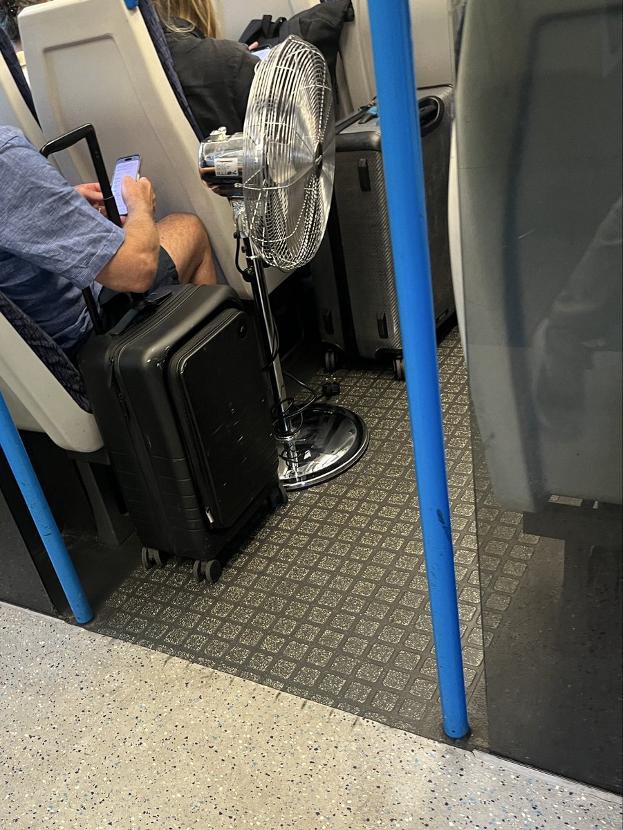 DavidARae's tweet photo. To the guy bringing his own fan on the train this morning, I salute you! https://t.co/bl0kfahrUG