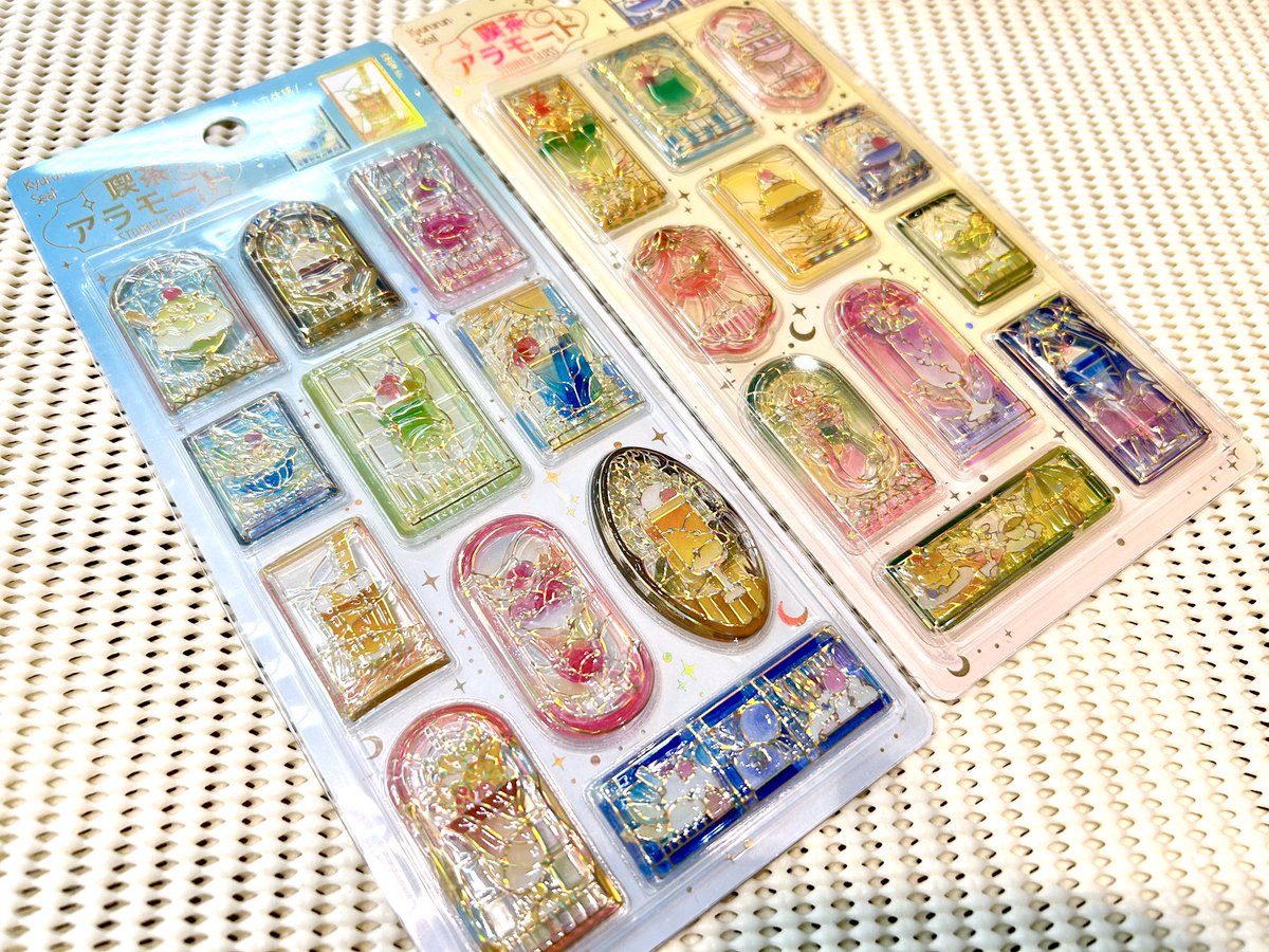 0140saga's tweet photo. BGMの人気シリーズ「きゅるるんシール 喫茶アラモード」が待望の再入荷！📢

幻の喫茶柄が店頭に。ステンドグラス・ブリュレ・シェル（税込473円）、ステンドグラスvol.2・雅（税込528円）のツヤツヤ立体感とラメが大人女子の心をくすぐります✨

#シール #文具女子 https://t.co/vjezVzsHg0