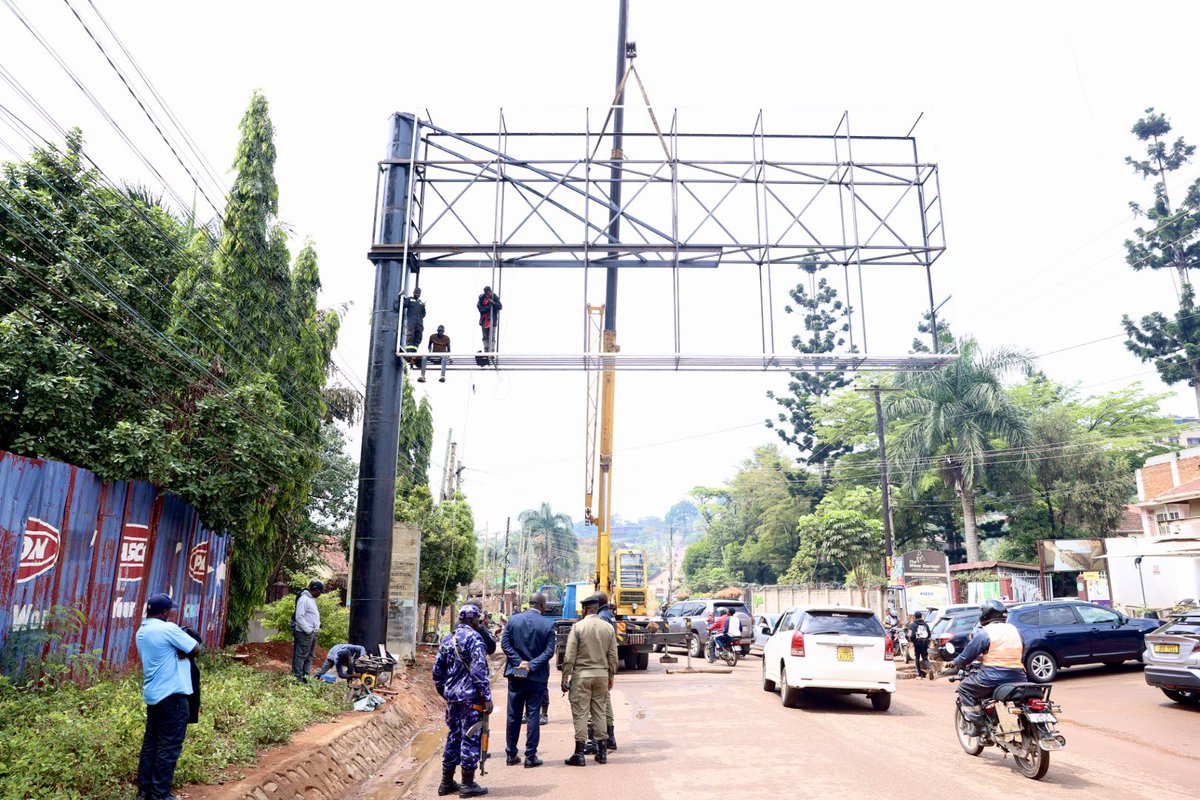KCCASpox's tweet photo. As part of our ongoing efforts to implement trade order and curb illegal development in the City, we have this morning apprehended errant individuals putting up an illegal billboard along Tank Hill road in Muyenga risking the safety of road users.
We urge the public to desist from such illegal acts and to follow the @KCCAUG guidelines in conducting similar business.
#ForALivableCity