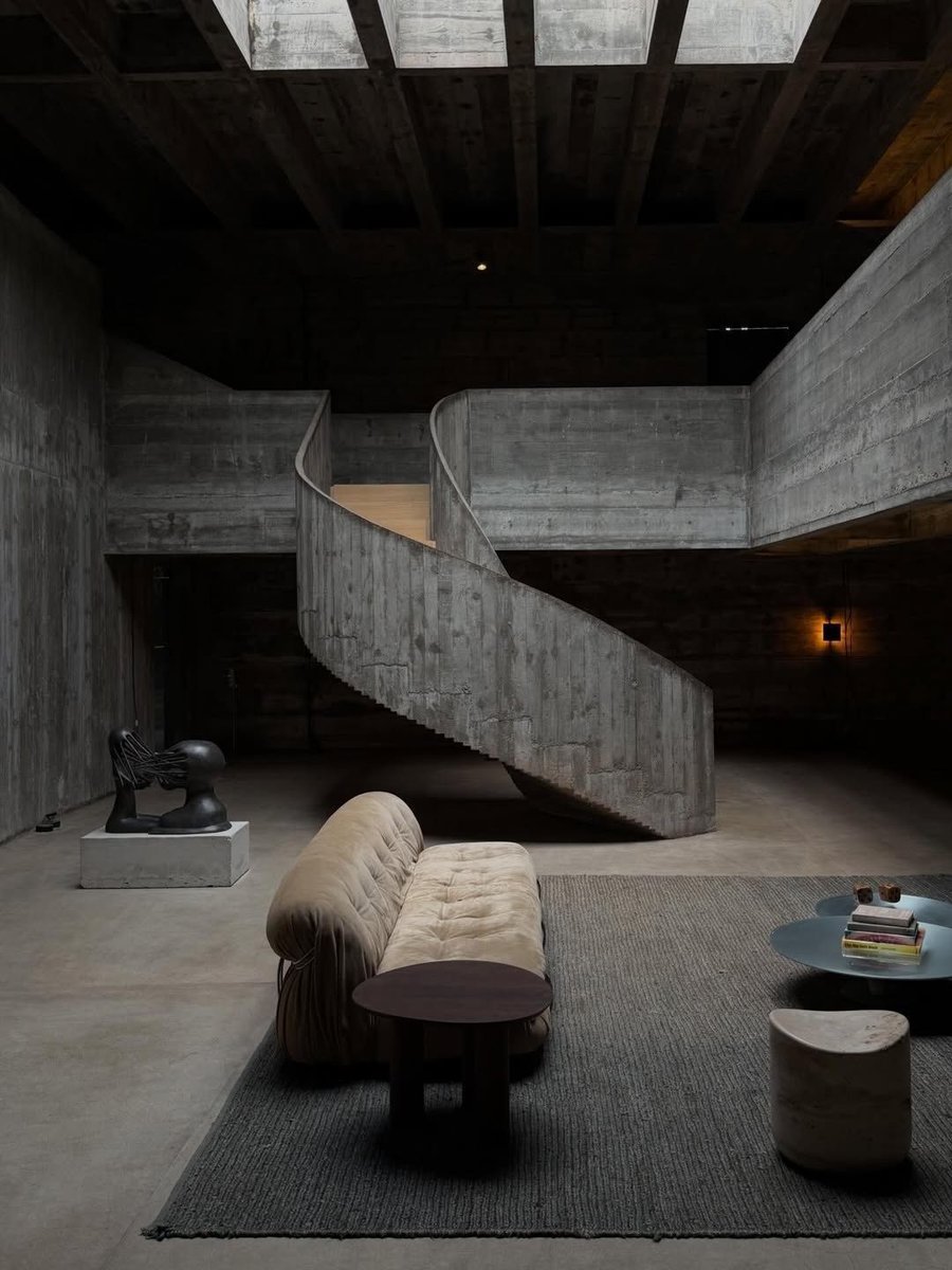 INTERIORBYHUT's tweet photo. A beautiful look inside Casa Millán in Brazil. That raw concrete spiral staircase is incredible. https://t.co/yQAdMkRwlB