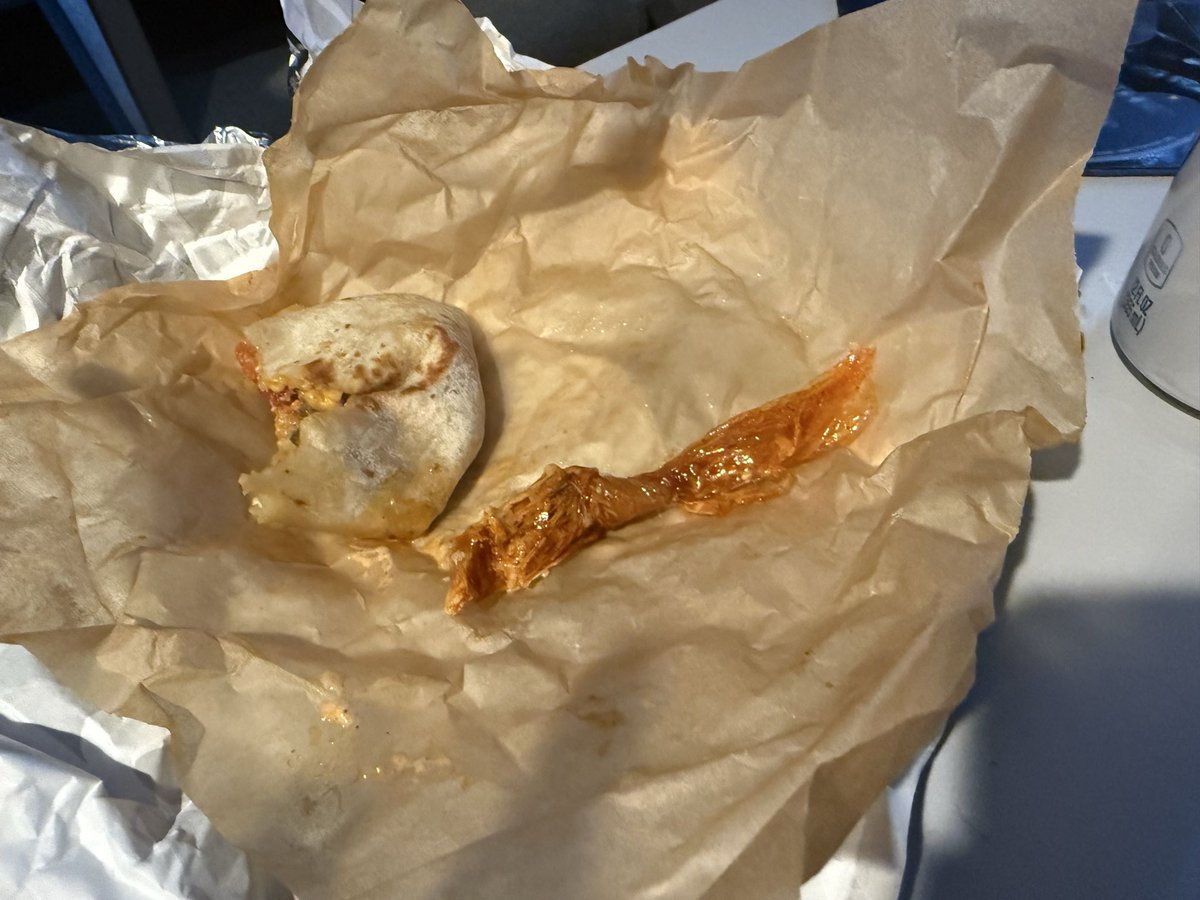 _laurhan's tweet photo. Surprise! A literal plastic bag inside the Taco Bell burrito last night. As an avid Taco Bell fan girl you’re Letting me down guys @tacobell #burrito #gross https://t.co/bGgHxoUY2C