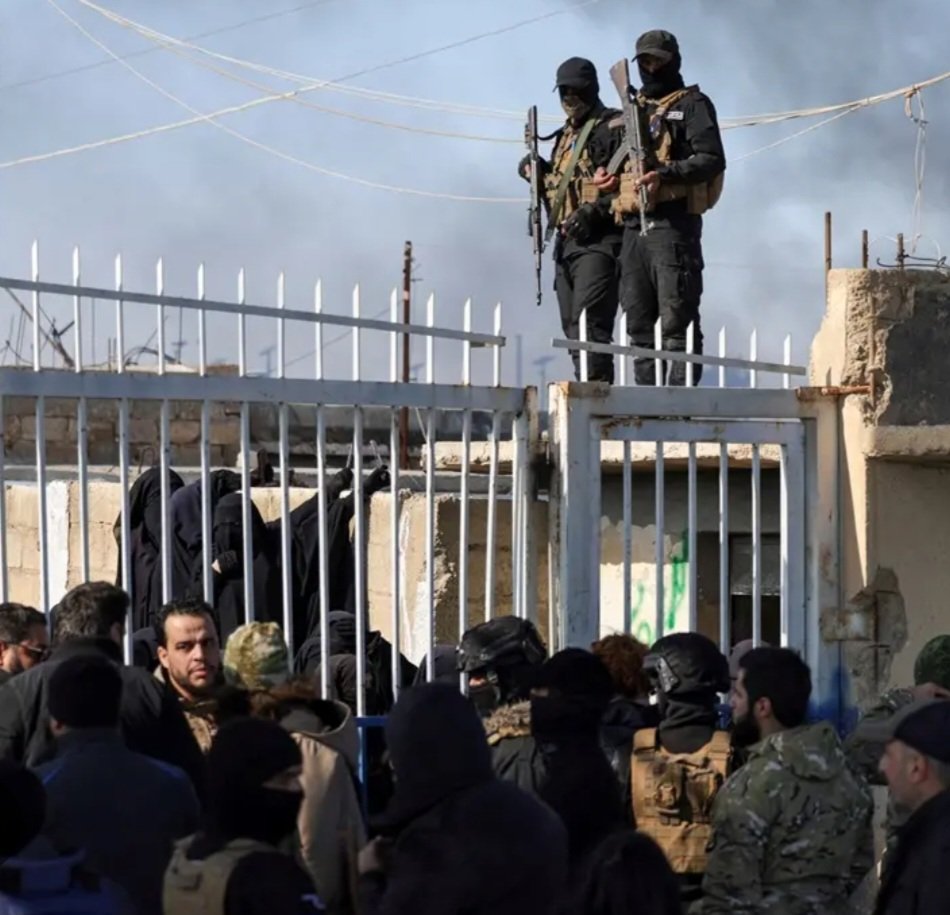 JChimirie66677's tweet photo. The Taliban Got £171 Million. Al-Jolani Got £95 Million. The Boats Keep Coming. Someone Is Happy With This Arrangement.

In October 2025, Britain removed Hayat Tahrir al-Sham from its list of proscribed terrorist organisations. Months earlier, Foreign Secretary David Lammy had flown to Damascus and handed its former leader, Ahmed al-Jolani, £95 million in aid. On 31 March 2026, al-Jolani arrived at Downing Street for talks with Keir Starmer, the first visit by a Syrian head of state to London since Assad's fall. He also met the Attorney General and the Home Secretary. Al-Jolani led HTS from its founding. Before the rebranding, his organisation was designated by the British government itself as a terrorist group. The designation was lifted. The cheque was written. The visit was photographed. According to Downing Street's own readout, Starmer used the meeting to urge "closer work together on returns of illegal migrants, on border security, and on tackling people smuggling networks." The former leader of a proscribed terrorist organisation was being asked to help stop the boats.

Britain sends £171 million a year to Afghanistan. The Taliban has banned women from working for the NGOs that previously delivered it. The government's own parliamentary documents acknowledge the aid cannot be effectively delivered. Ninety-four percent of NGOs fully or partially ceased operations after the ban. The money goes anyway.

In January 2026, al-Hol camp in northeast Syria, which held around 9,000 male ISIS suspects from an estimated 60 countries alongside tens of thousands of family members, collapsed amid fighting between Syrian government forces and Kurdish fighters. A hundred and twenty ISIS members escaped from Shaddadi prison. The Kurdish forces that had guarded the facilities for years withdrew. Syria confirmed a mass escape of ISIS-linked individuals following that withdrawal. Their whereabouts are unknown. Over 70% of those crossing the Channel are undocumented young men from Syria, Afghanistan, Eritrea and Sudan. They carry no papers. Their histories cannot be verified. Britain has no biometric screening mechanism capable of checking arrivals against Syrian detention escape lists, because Syria has no functioning civil registry against which to check them. So the question that nobody in government is prepared to answer is this: how many of the men arriving on British beaches since January 2026 were in those camps? The honest answer is that nobody knows. The more troubling answer is that the government has built no mechanism to find out.

Jonathan Hall, the government's own Independent Reviewer of Terrorism Legislation, said in the aftermath of the Belfast stabbing that asylum seekers from conflict zones present elevated risk profiles, that trauma from witnessed or perpetrated violence compounds that risk, and that his questions about the national security implications of mass migration had been met by the government with silence. The security services' own assessment framework treats exposure to serious violence as a material risk factor. Hall is not speculating. He is describing the government's own methodology.

In the year to June 2025, asylum applications rose 17% and small boat arrivals rose 14%. Twelve new asylum centres were opened this week without informing the MPs in whose constituencies they sit. Speaker Lindsay Hoyle called it totally unacceptable from the chair. Hotel accommodation contracts run until 2039.

A government trying to stop the boats does not pay the regimes the arrivals are fleeing. It does not hand £95 million to a former proscribed terrorist and ask him to tackle people smuggling. It does not build hotel infrastructure contracted until 2039. And it does not open twelve new asylum centres without telling the MPs whose constituents will live next to them.

David Lammy meets Ahmed al-Jolani. Al-Hol camp, northeast Syria.
