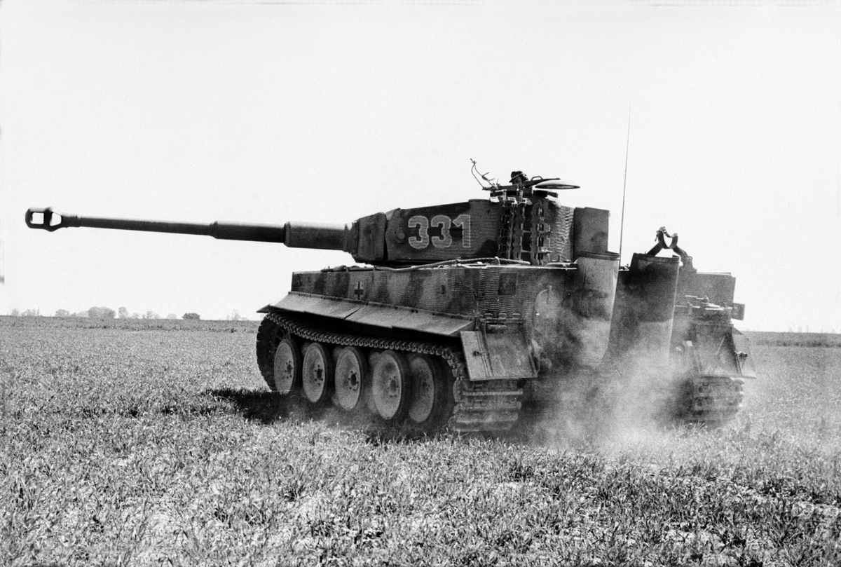 VoicesofWW2's tweet photo. June 25, 1944. D-Day plus 19.

At 4:15 in the morning, in thick summer fog, the British 49th Infantry Division begins to advance.

Tomorrow, Operation Epsom starts. Tonight, the 49th is doing the work that makes tomorrow possible: seizing the high ground at Rauray, seven kilometers west of Caen, to prevent German tanks from hitting VIII Corps in the flank when 60,000 British troops cross the start line.

The mist is so heavy that soldiers hold onto each other in the dark. The Hallamshire Battalion is taking compass bearings every few yards. The 11th Royal Scots Fusiliers disappear into the fog and immediately begin taking casualties.

This is called Operation Martlet.

But to understand what the 49th Division is fighting against this morning, you need to understand what the Germans have left.

---

Germany's best division in France on June 6 was called the Panzer Lehr.

"Lehr" means instruction, or teaching. The division had been formed in late 1943 from Germany's training and demonstration units: the most experienced tank instructors and school troops in the Wehrmacht, assembled specifically to form the strategic reserve for the anticipated Allied invasion. Almost all of its original cadre had seen combat on the Eastern Front, in North Africa, in Sicily or Italy. Many had decorations for bravery. These were not green conscripts. These were men who had survived years of war and had been teaching others how to survive it.

The division was the only Panzer division in the Wehrmacht to transport all of its infantry in armored halftracks. Not just one battalion in halftracks as was standard. Every battalion in both Panzergrenadier regiments rode in armored vehicles. Its reconnaissance battalion drove the new Sd.Kfz 234/2 Puma armored cars. Its combat engineers were armored. Its panzer regiment carried 208 tanks and assault guns when Normandy began: 97 Panzer IVs, 86 Panthers, 6 Tigers, 9 assault guns.

It had a nickname inside Germany: the "Parade Division." People said it was trained for display rather than combat. What the name really captured was something else: this was a division equipped and manned at a level that the rest of the German army could only demonstrate, never sustain.

On June 6, 1944, Hitler's personal reserve included the Panzer Lehr. It could only be released with his direct authorization. He was asleep when the landings began. His staff didn't want to wake him.

Authorization came around noon.

The division was ordered to march immediately from its assembly area near Le Mans to the front near Caen.

The distance was approximately 150 miles.

---

On June 7, 1944, Panzer Lehr marched through France in daylight.

German movement doctrine required night marches. You moved your tanks and heavy vehicles under cover of darkness because Allied fighter-bombers owned the daylight sky. Allied air power had been established over France for months. The Luftwaffe had been ground down to a shadow. By June 1944, Allied aircraft outnumbered German aircraft over France by roughly 30 to 1, and German pilots had neither the training nor the fuel to contest that imbalance.

But the order said immediately. The front was breaking open. The division moved.

The P-47 Thunderbolts found them on the roads.

On June 7 alone, before Panzer Lehr fired a shot in combat, before it reached the battlefield for which it had been specifically formed, it lost 84 halftracks, prime movers, and self-propelled guns. 40 fuel bowsers. 90 soft-skinned vehicles. 5 tanks.

All of them destroyed from the air while marching.

One day's march. That was more transport destroyed than many divisions lost in actual battles.

The division arrived at the front in Normandy on June 8, already bleeding, already short of fuel, already without a large part of the transport that was supposed to keep it moving and fighting.

---

The Allied air campaign against German logistics had been going on for months before D-Day.

In early 1944, there was a fierce internal debate among the Allied high command about how to use the strategic bombing forces. General Carl Spaatz, commanding the American strategic air forces, wanted to bomb German oil production. Air Marshal Arthur Harris at RAF Bomber Command wanted to continue the strategic bombing of German cities. Both men believed their campaigns were the most direct route to German defeat.

Eisenhower wanted something different. He wanted to bomb the French and Belgian railway network: every marshaling yard, every bridge, every major junction. Destroy the transport infrastructure that connected Germany to its forces in France, and when the invasion came, those forces would be unable to move, unable to receive supplies, unable to reinforce.

This was the Transportation Plan.

It was controversial. French civilians would die in the bombing. The French government in exile protested. Churchill worried about the political consequences. Roosevelt overruled the objections.

By D-Day, the French railway system was carrying approximately 30 percent of its normal traffic.

German divisions that would normally take three or four days to move by rail from central France to Normandy were taking two or three weeks. Das Reich, as I told you two weeks ago, left Montauban on June 8 and arrived piecemeal between June 15 and June 30. The Panzer Lehr, ordered to march immediately, was hit from the air every day of the march. Other divisions coming from distant positions were cut off from their supply trains entirely.

The campaign was being won before most of the killing even began.

---

The German forces holding the line on June 25, between the 49th Division and Rauray, are shells.

The Panzer Lehr Division had suffered approximately 2,300 casualties by June 24, mostly among its infantry. It was supposed to be relieved for refit but the division that was to replace it hadn't arrived yet. Its tanks tell the story: from 208 operational on June 6 to 36 Panzer IVs and 32 Panthers fit to fight by late June.

The 12th SS Panzer Division, two weeks into combat against the Canadians, had taken about 2,550 casualties, roughly half of its infantry strength.

In the fog before dawn on June 25, these are the defenders the 49th Division is walking into.

---

The 49th "Polar Bears" Division had been in the British Army since 1939 but had never fought as a complete division. Today is the first time.

They advance through the mist in two columns. On the right, the 4th Lincolns and tanks of the 24th Lancers push toward Fontenay. A German officer tries to signal his men with a bugle; he is shot before he gets the call out. A group of German halftracks are destroyed with hand grenades. The Hallamshires knock out two German tanks with 6-pounder anti-tank guns and reach the first objective line.

On the left, the 11th Royal Scots Fusiliers push into Fontenay itself. The mist and smoke have reduced visibility to almost nothing. As the sun rises, German snipers and machine-gunners begin to pick off soldiers who become silhouettes against the fog. The Fusiliers reach the village and fight through it hand-to-hand.

By nightfall, the 49th Division has advanced roughly a mile and a half. Rauray is still about a mile away. The objectives have not been fully reached.

---

But something more important has happened.

The German command, watching the 49th Division's assault from the west, is uncertain where the main British blow is going to land. Is it here, aimed at Rauray and the road toward Villers-Bocage? Or is this a diversion?

To meet the threat, German reserves are moved west. Tank battalions shift. Infantry elements consolidate against the 49th Division's pressure. The high ground at Rauray is held at increasing cost.

The 49th Division has not taken Rauray.

But it has pulled those German tank units out of position.

Tomorrow morning, VIII Corps crosses the start line seven miles to the east, toward the Odon River and the outflanking of Caen. The area where German armor was supposed to be sitting in reserve is now occupied by those reserves trying to stabilize the Rauray front. When the 15th Scottish Infantry Division steps off into the bocage tomorrow, the German response will be slower and weaker than it would otherwise have been.

A British analyst writing after the battle put it plainly: the German armor had been "left out of position when the main attack by VIII Corps began."

---

June 25, 1944 is not one of the famous days of the Normandy campaign. No single action defines it. No famous name is attached to it.

But in the village of Fontenay, in the fog before dawn, soldiers who have never fought a real battle are holding hands to maintain direction, taking compass bearings every few yards, walking into fire from men who have been fighting since Poland.

They are buying tomorrow.

---

Tomorrow: June 26, 1944. Operation Epsom.

The 15th Scottish Infantry Division crosses the start line. 60,000 British troops, 600 tanks, artillery that fires for miles. The objective is the Odon River and the high ground beyond it, Hill 112, from which all of Caen can be seen.

The Germans are going to move every Panzer division they have left to stop it.

The fight for Hill 112 is going to last weeks. And it is going to cost both sides more than anyone expected.