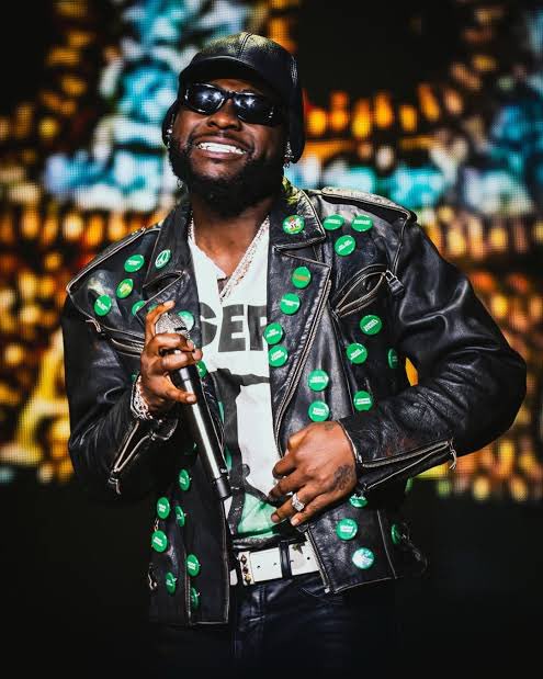 Esther_d_Great's tweet photo. At the FIFA World Cup Countdown Concert, Davido walked on that global stage with 49 names on his chest abducted students &amp; teachers from Oyo State.

That jacket said it all. BRING THEM HOME. 🇳🇬

— Esther the Great

#BringThemHome #OyoKidnapping  #NigeriaIsBleeding #JusticeForOyo https://t.co/RlXVj9g9Hk