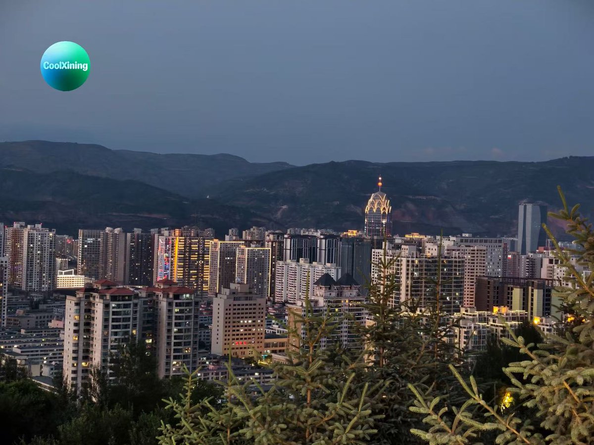 QinghaiPlus's tweet photo. Xining unfolds its evening grace. Layered mountains frame the lit cityscape, the Plateau Pearl shines bright, carrying the timeless spirit of northwest China. https://t.co/DQK5XeyQ84