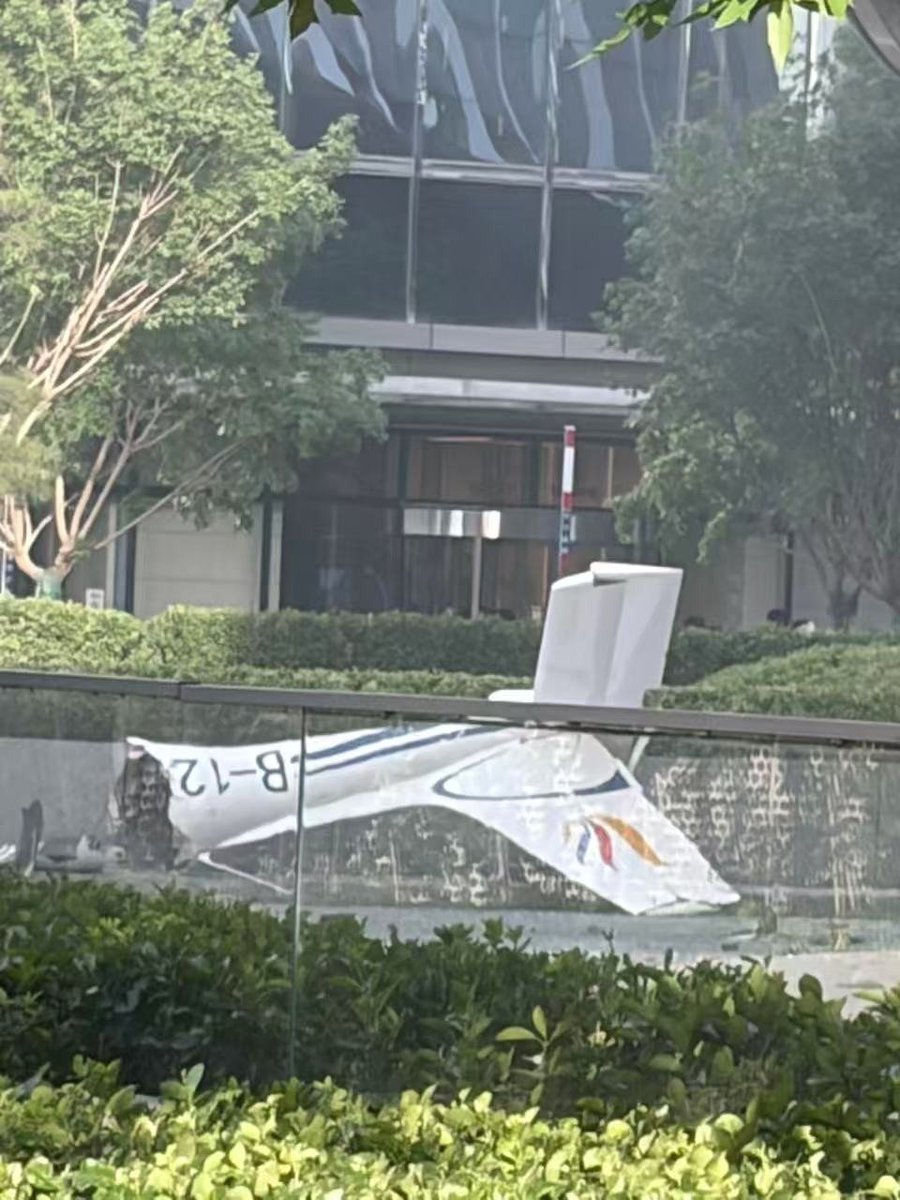 clashreport's tweet photo. WATCH: A small plane slammed into Beijing's tallest skyscraper. 

The Sunward SA60L Aurora (reg. B-12PP), operated by Shuangyue General Aviation Beijing, struck the CITIC Tower (China Zun), disintegrating on impact — debris and small fires fell near the building's east entrance.

Casualties unconfirmed; building evacuated.