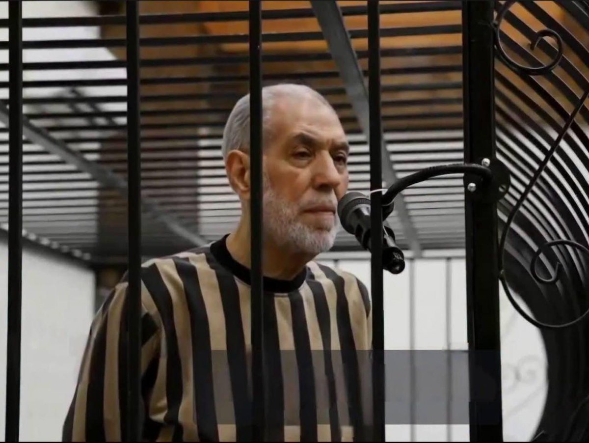 TheCradleMedia's tweet photo. Former Syrian Grand Mufti Ahmed Badr al-Din Hassoun stands trial under HTS-led government
——
Former Syrian Grand Mufti Ahmad Badr al-Din Hassoun is standing trial under Syria's HTS-led government. Hassoun, a prominent Sunni religious figure in Syria, was brought blindfolded to his first court hearing in Damascus on Thursday.

Hassoun, who long advocated for national unity and publicly forgave the extremists who killed his son on the Idlib–Aleppo highway in 2011 "for the sake of the unity of the homeland," is facing charges including alleged complicity in war crimes and crimes against humanity, incitement to murder, and other offenses.

These include provoking civil war, abuse of influence, ties to the former Assad government, preaching to soldiers, praising military commanders, supporting the Russian and Iranian interventions, backing IRGC Quds Force commander Qassem Soleimani, and his 2018 appeal urging the people of Idlib to "stop trusting the Turkish army and return to the embrace of the homeland."

Meanwhile, no judicial proceedings have been launched over the 2013 bombing that killed more than 40 people, including Umayyad Mosque imam Sheikh Mohammad Said Ramadan al-Bouti, while he was delivering a sermon at Al-Iman Mosque in Damascus.