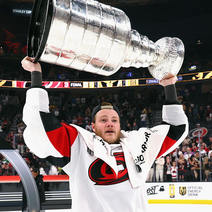 Eric Robinson lifts the Stanley Cup.