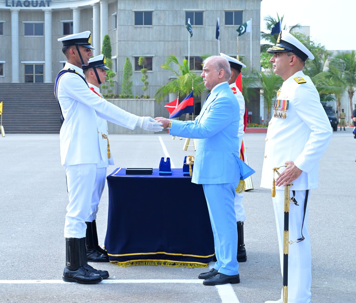 PakPMO's tweet photo. Prime Minister Muhammad Shehbaz Sharif distributing awards among the high achievers of the term at the passing out ceremony of 125th Midshipmen and 33rd SSC courses at Pakistan Naval Academy, PNS Rahbar. Karachi, 27 June 2026. https://t.co/snei4OQSN4