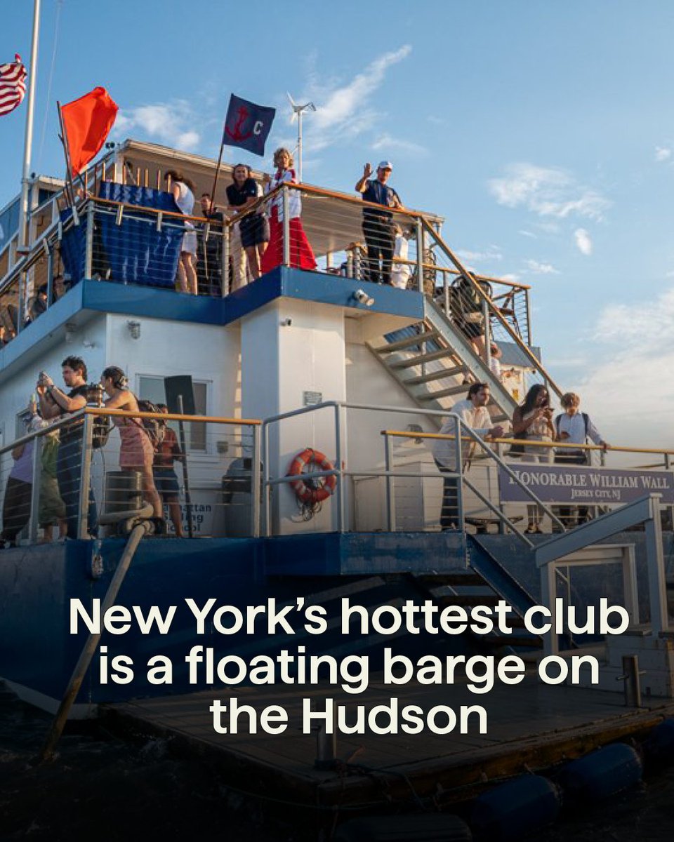 Gothamist's tweet photo. A barge is anchored in the mouth of the mighty Hudson River, not far from Lady Liberty and near Ellis Island and a constant torrent of boat traffic. On that barge, in what was formerly a members-only clubhouse that belonged to the Manhattan Yacht Club, is the Honorable William Wall — or "Willy Wall" — a two-story bar that is open to the public and has become a hot spot for plein air drinking.

Visitors and members alike are ferried out via the Admiral’s Launch, a decommissioned U.S. Navy vessel that leaves at regular intervals from the Manhattan Yacht Club’s Jersey City headquarters: https://t.co/dGCOeFyNO6
