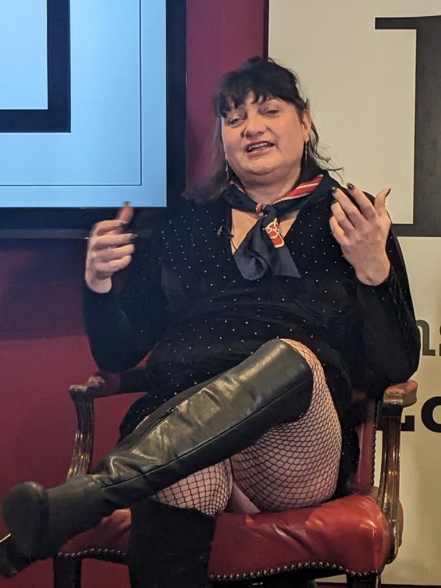 jk_rowling's tweet photo. Sadly, Fred's refusing to debate me. To prove I have no hard feelings, and that Fred does engage with some lucky women, here's a picture of him debating @HJoyceGender. I hear he left an indelible impression on the audience. And the chair. https://t.co/GVIYZ86xxP