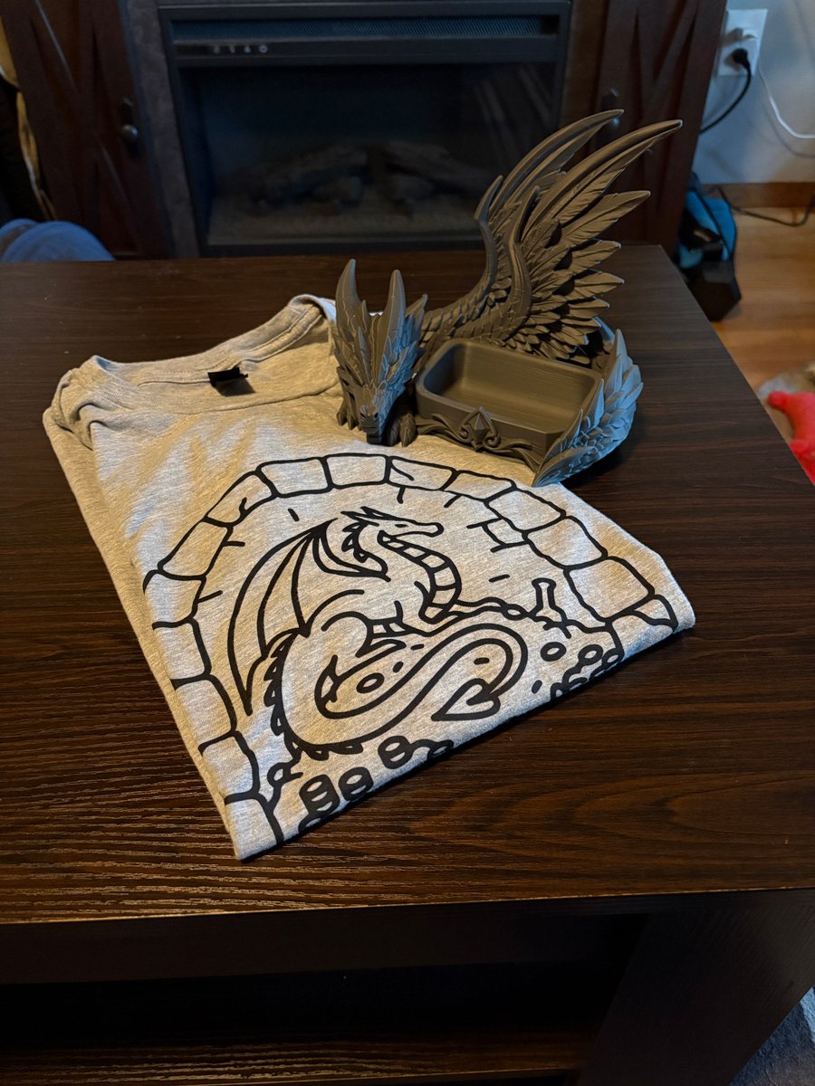 BradThomte's tweet photo. Prepping for the craft show is big fun. A new d20/TTRPG bookmark I designed and laser cut, and a company logo shirt from one of my print providers and my business card holder, custom 3-D printed for me by my brother.
#dnd #craftfair https://t.co/n96SjFMDjx