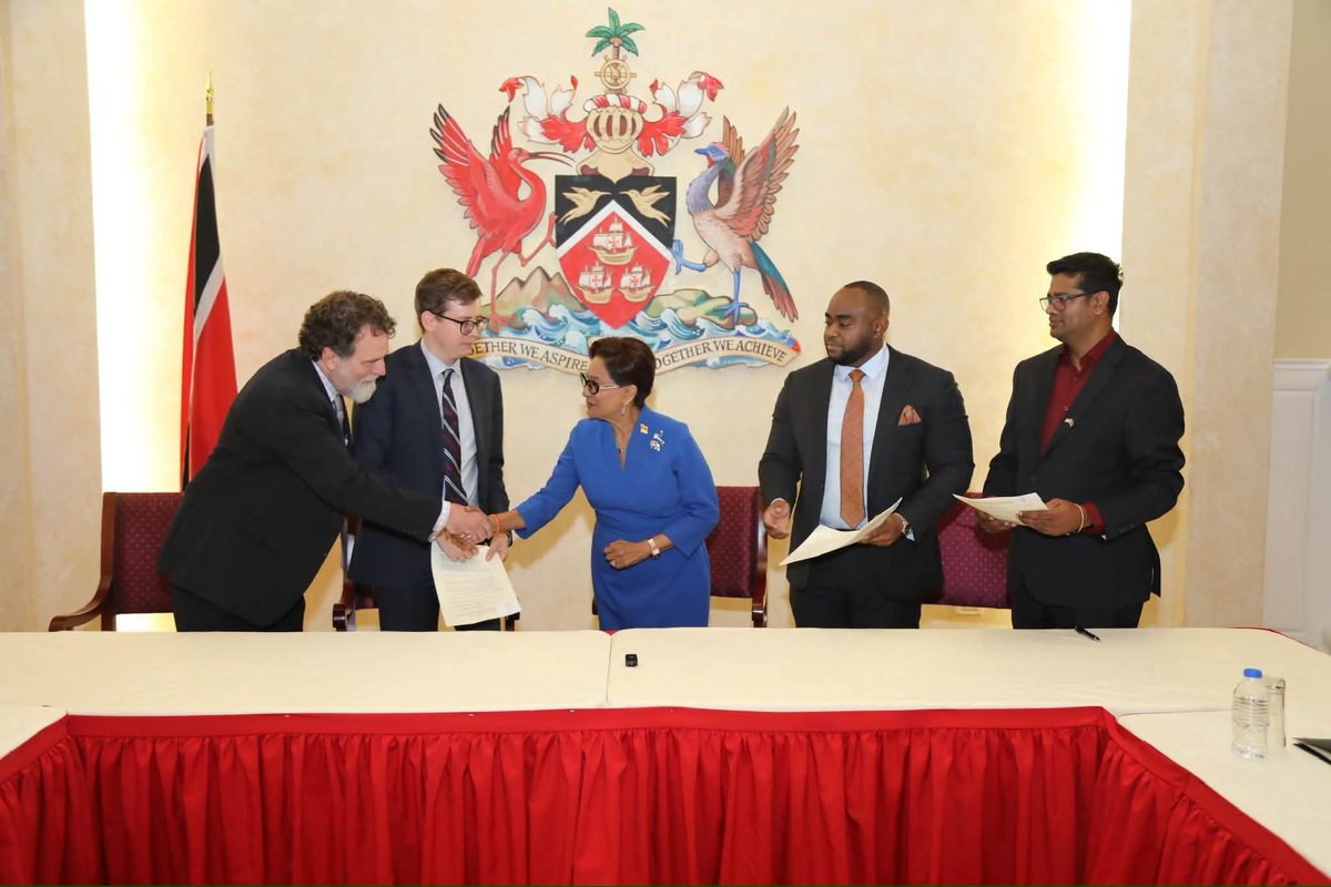 PM_Kamla's tweet photo. INVESTMENTS & JOBS 
On Friday, my Government took another important step in strengthening the economic partnership between Trinidad and Tobago and the United States through the execution of three Memoranda of Understanding (MOU) with leading United States organisations.

These agreements establish frameworks for cooperation in large-scale data centre development, artificial intelligence infrastructure and the recommissioning of the iron and steel plant at Point Lisas for strategic metals production.

I thank the Honourable Sean Sobers, Minister of Foreign and CARICOM Affairs, for signing these agreements on behalf of the Government of Trinidad and Tobago.

Through our first MOU with Ernst & Young LLP, we have established a framework for collaboration on the development of large-scale data centres and supporting infrastructure, leveraging EY's Energy to Intelligence (E2I) platform. Under this framework, EY intends to partner with third parties in the development of a 300 MW data centre in Trinidad and Tobago.

Our second agreement with Hummingbird AI Holdings LLC establishes a framework for preliminary cooperation, due diligence and coordination in relation to a proposed 150 MW artificial intelligence infrastructure and data centre facility, with the potential for long-term expansion to 500 MW. Subject to the successful completion of due diligence and the advancement of the project, initial commercial operations are targeted for the first quarter of 2028.

Our third MOU, signed with Pinnacle Steel and Vanadium Corporation, establishes a framework for further discussions and due diligence regarding the refurbishment, recommissioning and operation of the iron and steel plant at Point Lisas, which the company recently acquired.

Beyond steel production, this project presents Trinidad and Tobago with an opportunity to enter the global market for vanadium, a strategic metal used in aerospace and defence applications, including military aircraft. Should the project proceed, Trinidad and Tobago has the potential to supply a significant share - estimated at up to 50 per cent - of United States demand for this critical resource.

I also acknowledge the important role that will be played by the Point Lisas Industrial Port Development Corporation Limited (PLIPDECO), as landlord of the property and lands on which the plant is located, in advancing this initiative.

Taken together, and subject to these projects progressing beyond their current framework and due diligence stages, these initiatives represent the potential for investment exceeding US$5 billion over the coming years and are expected to generate more than 5,000 new skilled and semi-skilled jobs for our people.

These projects support our vision of transforming Trinidad and Tobago from an economy centred solely on energy molecules to one driven by innovation, technology, advanced manufacturing and high-value exports.

I extend my sincere thanks and appreciation to the Government of the United States for its role in facilitating these partnerships and helping to create new opportunities for growth, investment and prosperity for the people of Trinidad and Tobago.

Together, we are building the industries of the future and creating a stronger, more diversified economy for generations to come. 🇹🇹🤝🇺🇸