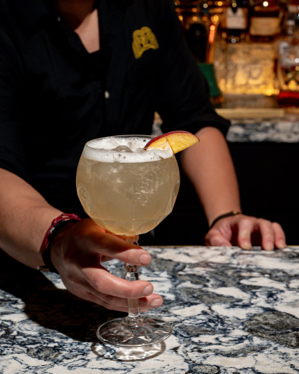 FountainRoom's tweet photo. If summer had a signature cocktail, this would be it. 🍑🌞 Vanilla-kissed Absolut, white wine, peach, orange cream bitters, and Sprite come together in our Sunny Day Sangria. https://t.co/qs6Kjyh02r