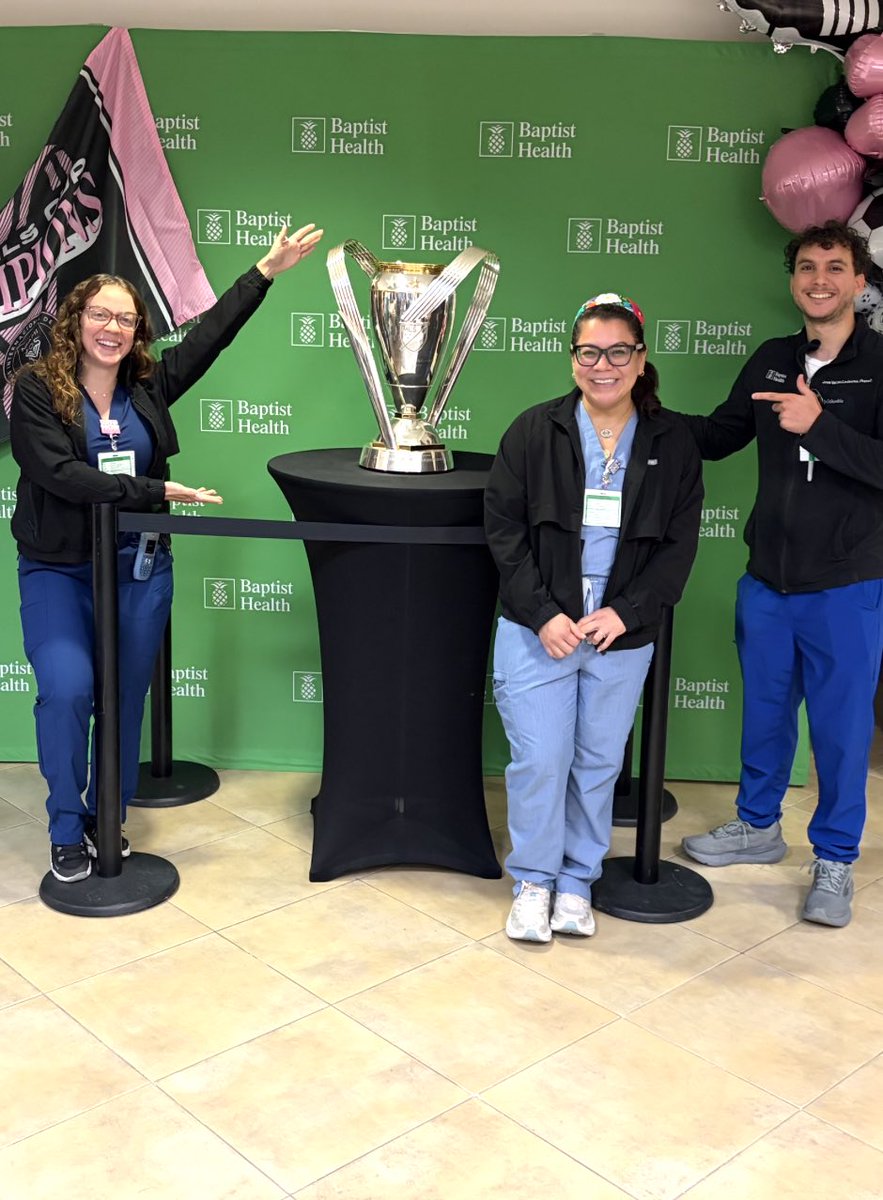 BaptistHealthSF's tweet photo. At the height of World Cup fever, the MLS Cup trophy won by @intermiamicf in 2025 stopped by Baptist Health Baptist Hospital! We loved the visit and seeing the smiles it brought to our employees. Thanks for making our day! 🍍 https://t.co/Uk9nwqV873