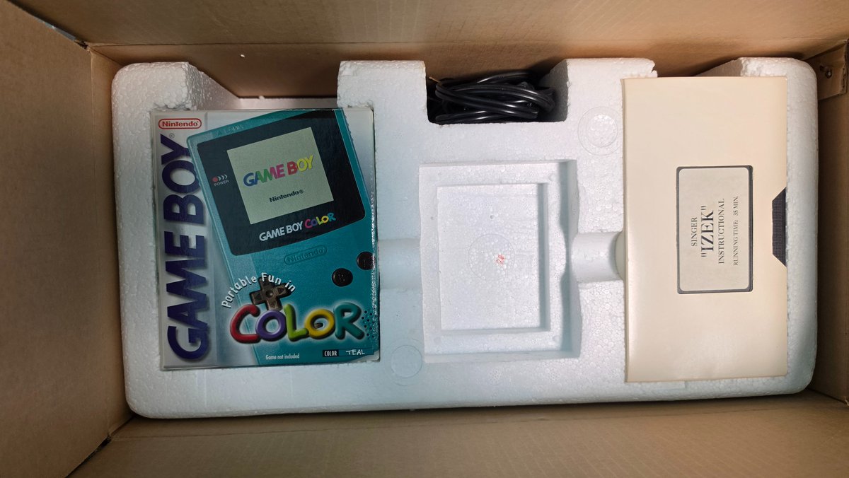 JoshFairhurst's tweet photo. One of the weirdest Game Boy Color items I own is the Game Boy Color sewing machine. This has a unique cartridge with the sewing machine software and a matching GBC that goes with it. https://t.co/GHIdCcPvfd
