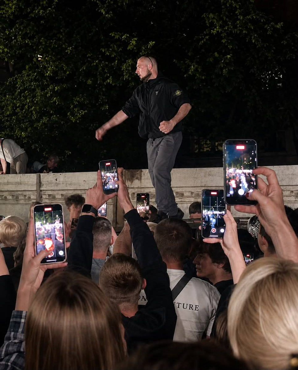 HavryshkoMarta's tweet photo. ⚠️It has now emerged that the unexpected icon of yesterday’s anti-draft-officer riot in Lviv—the man who leapt onto the overturned TRC vehicle—was not some “draft dodger,” as the far right eagerly smeared him, but an active-duty Ukrainian soldier (!) on leave.

That detail says more than any official statement ever could. 

He is clearly one of those soldiers who cannot stomach watching draft officers drag the Ukrainian uniform through the mud by kidnapping and torturing civilian men—men whose only real offense is refusing to be fed into the meat grinder for Zelensky’s corrupt regime and the profits of Western arms producers.