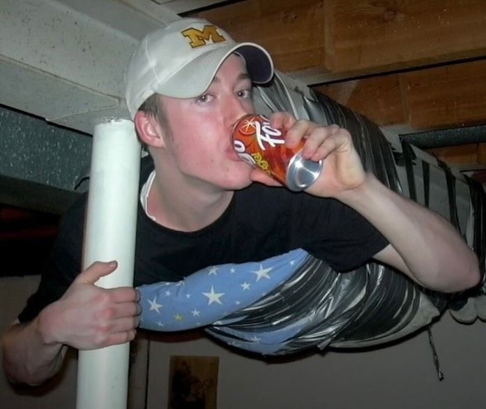 thegoldenaged's tweet photo. The iconic “gamer duct-taped to ceiling” during a LAN party in Michigan (2003) https://t.co/waby2lILE4