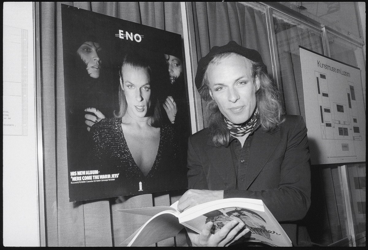 dark_shark's tweet photo. Brian Eno visiting an exhibition about transvestism, Lucerne, Switzerland, 1974 https://t.co/LMVnOHqm5D
