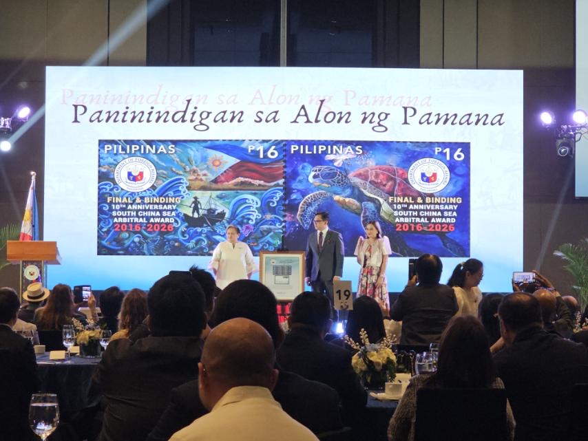 bncdotph's tweet photo. LOOK: Foreign Secretary Theresa Lazaro and Philippine Post Master General Maximo Sta. Maria III unveil the commemorative postage stamp marking the 10th anniversary of the country's arbitral court victory against China in 2016. 

An international tribunal in The Hague, Netherlands, invalidated China's sweeping and historical claim over the South China Sea. | via Michaela Del Callar, https://t.co/9R0McaxxsO