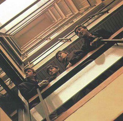 crockpics's tweet photo. The Beatles posing in the stairwell of EMI House in London during the historic photo session for their debut album, "Please, Please Me", February 1963. Photo by Angus McBean. 

The original plan was to photograph the band outside the insect house at the London Zoo, but when the zoo officials turned down the request, the team scrambled and decided to use the sleek balconies of their own record label building instead.