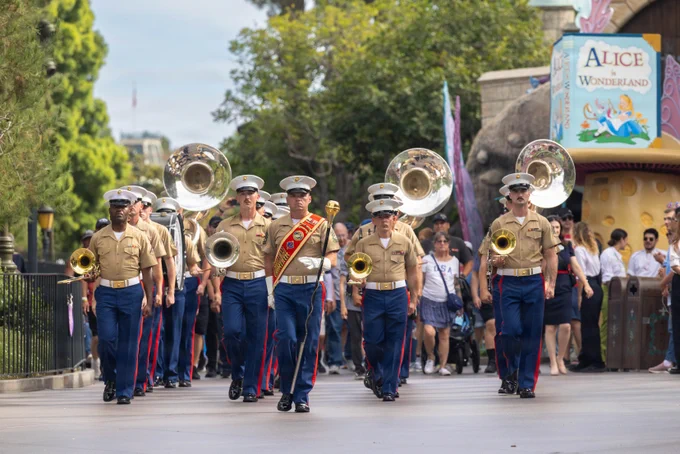 U.S. Marines with the 1st Marine Division Band salute during a flag retreat ceremony at Disneyland California Adventure Park in Anaheim, California, July 4, 2026. The 1st MARDIV Band was featured in\u202Fseveral parades and stationary performances during the park\u2019s annual Independence Day celebration. (U.S. Marine Corps photo by Lance Cpl. Anamile Arce)\n\n