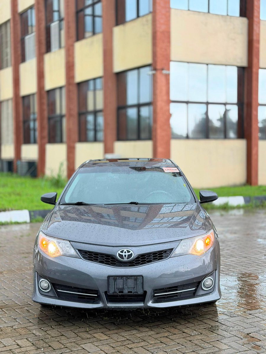 Ghostvariables's tweet photo. 🚘DIRECT TOKS🚘
                  🚨
Behold, a direct vessel from the distant lands of the Americas 🇺🇸! Untouched by the wrath of collision, wholly unblemished and free of affliction.

The Lineage of the Vessel:
 Name: Toyota Camry Sport, of the mighty tribe of SE V6.

 Genesis (year) : Forged in the year of our LAWD 2014.

 The Crossing Delivered past the guards of Customs in the seventh month of this very year, 2026 🛃.

The Blessings Contained Therein:

 * Thou shalt need no iron key, for by the press of thy thumb shall its heart awaken 👍
 * It possesseth unseen guides to lead thee safely into thy parking space ✅
 * Its flesh is as it was in the beginning; a first body of perfect form.
 * Clothed in raiments of pure white without, and skins of deep black within.
 * Fashioned with seats that stretch forth to cradle thy thighs upon the journey.
 * Its breath is pure, for the catalysts and sensors of the air remain whole and unplucked.
 * The music thereof is like unto a heavenly choir, boasting the premium sounds of Mark Levinson.

💰 The Tribute Required:
Bring forth 16 Million naira Let no man speak of bargaining, for the decree is firm! 📌

📍 Where Thou Shalt Find It:
Seek ye this chariot on the path of Lasu Igando, near the resting place of Ipaye, even directly across from the great market known unto men as Twins Faja 🏟️.