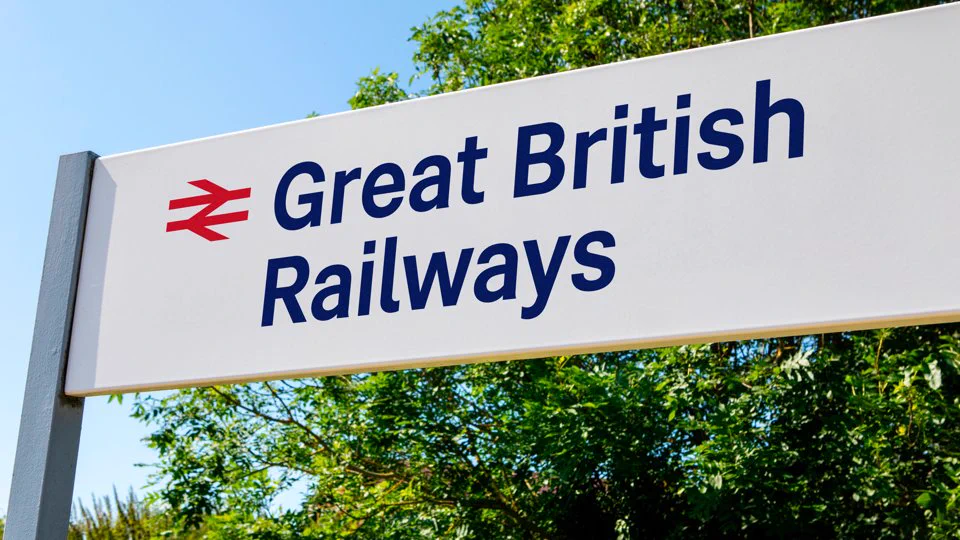 Outdoor 'Great British Railways' sign, with trees in background