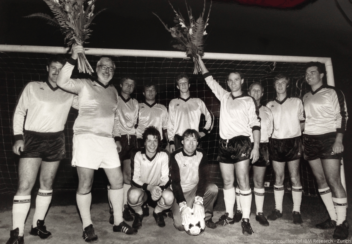 NobelPrize's tweet photo. On October 15, 1986, the football teams of IBM Zurich Laboratory and Dow Chemical were due to play a game against each other. But it was almost derailed by a sudden announcement made just a few hours before kick-off. 

The sudden announcement was that two of the IBM players – Gerd Binnig (right, holding flowers) and Heinrich Rohrer (left, holding flowers) had been awarded the Nobel Prize in Physics.

The two laureates were rushed off to a press conference, but they insisted the conference end on time because their football team needed them. Although IBM lost the match 2-4 they still had a reason to celebrate.