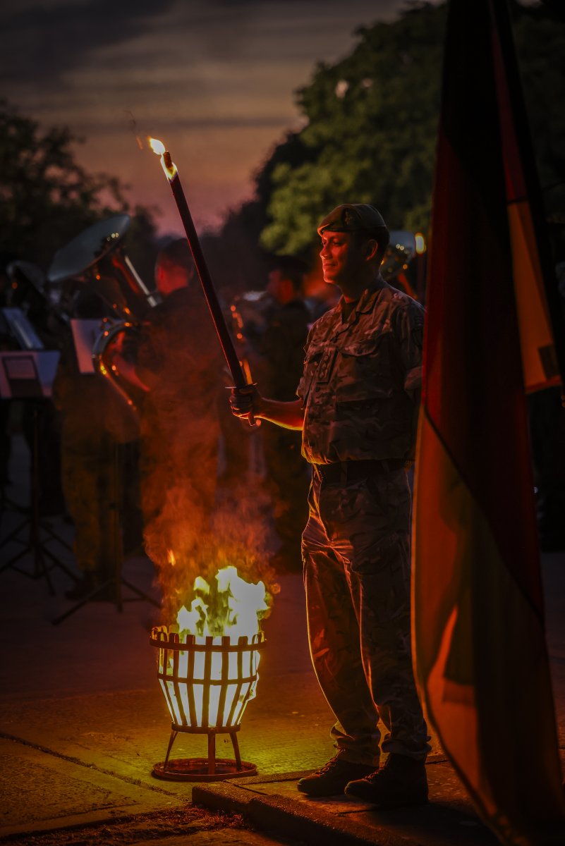 HQARRC's tweet photo. German Bivouac 2026.  🇩🇪

The ARRC German contingent hosted a special ‘bivouac’ (night watch) garden party for their NATO colleagues. Traditionally celebrated on October 3rd, this normally falls within an exercise period, so it is brought forward to coincide with the better weather.

With around 300 guests from all 20 Partner Nations in HQ ARRC, the event was kindly supported by a Bundeswehr field catering team and 40 members of the German Airforce Music Corps (Luftwaffen Musik Korps) based in Muenster, Germany.

The night was capped off under darkness with torches lit and the National Anthems of Germany and the UK played by the German Airforce Music Corps.

#STRONGERTOGETHER #WEARENATO