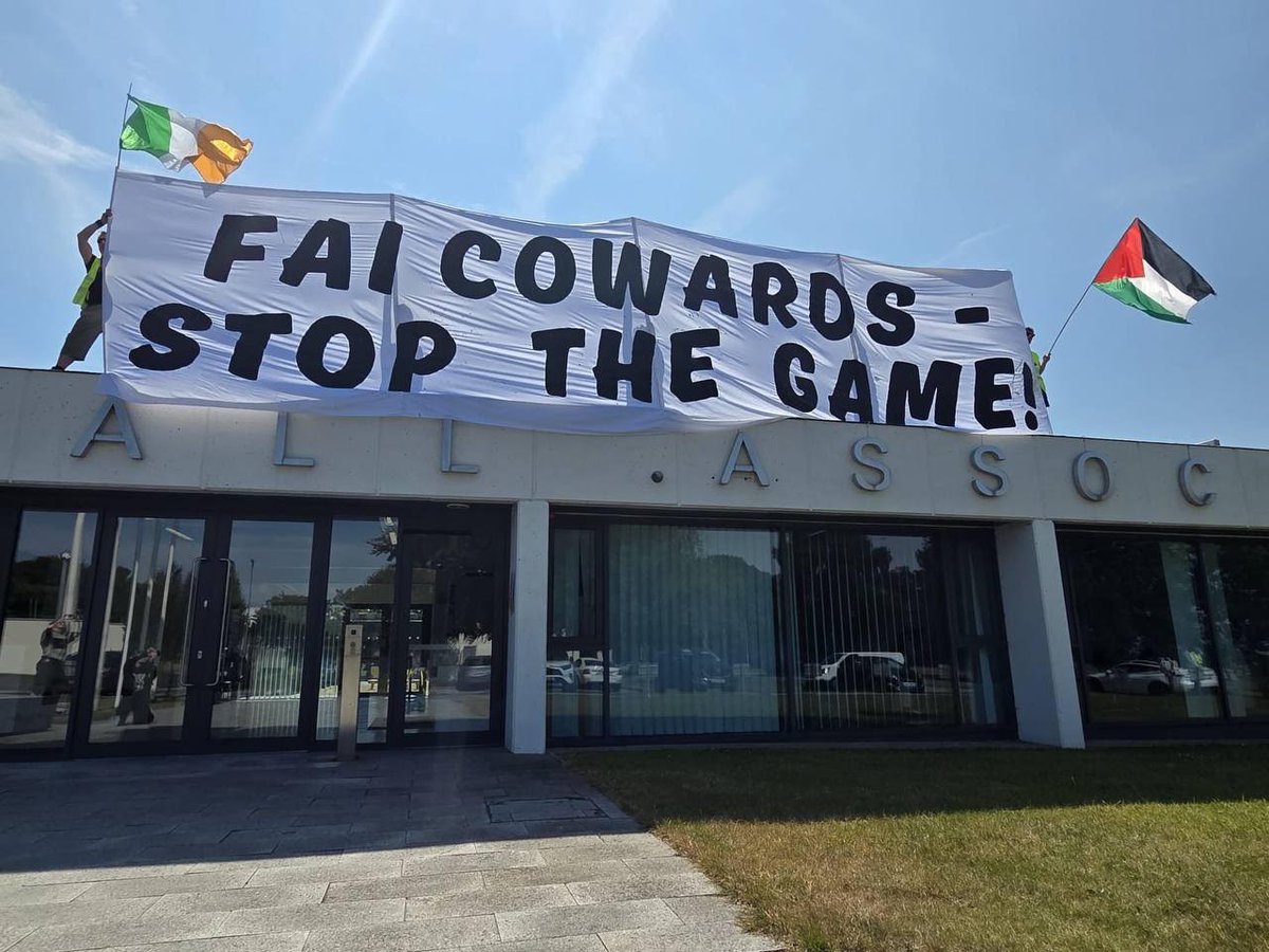 noriordan's tweet photo. Éirigí activists scaled the roof of FAI HQ this morning in protest at General Assemby vote to endorse Board motion to fulfil its Nations League fixtures against Israel. https://t.co/Q1OsUlhTXr
