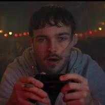 Image of person playing a gaming device.