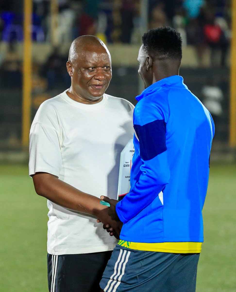 sportslens1's tweet photo. The smile said it all. 😊 Coach Mike Hillary Mutebi watching his former student Mustafa Kizza lead a successful charity match in his honor was a true full-circle moment. A legacy that goes beyond football. ❤️⚽

#MikeMutebi #MustafaKizza @kizza_mustafa @KCCAFC https://t.co/IfulJh7Za6
