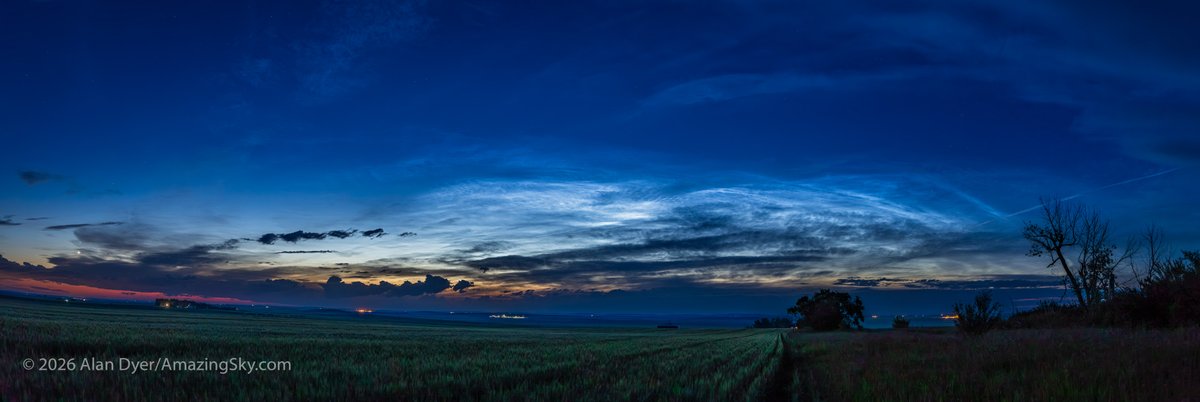 amazingskyguy's tweet photo. A panorama of "night shining" noctilucent clouds from home amid a wheatfield in southern Alberta, July 9, 2026. This was at about 11:07 pm MDT, with the bright blue-white noctilucent clouds shining behind dark foreground clouds to the north. Details in Alt Text.
@twanight https://t.co/4Ws2YZ5ik2