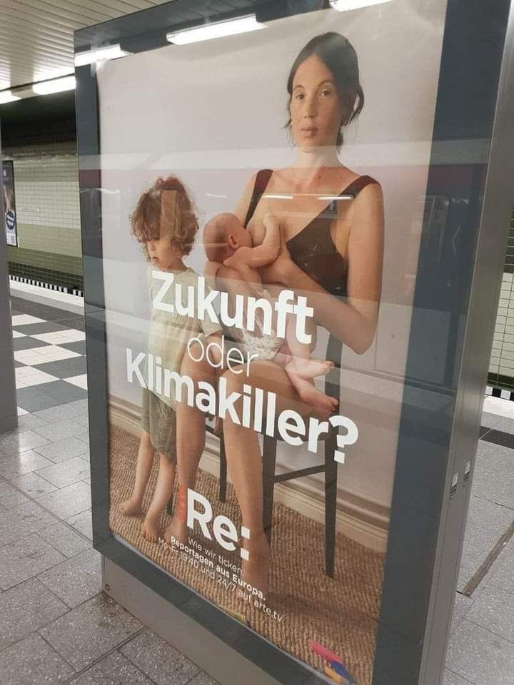 MarioBojic's tweet photo. 🚨🇩🇪In Germany, ads displayed in metro stations show a mother with two young children.

The message on the advertisement reads, “The Future or a climate killer,” implying that our children are destroying the planet.

These people are completely insane. https://t.co/uYVrZiqnwl