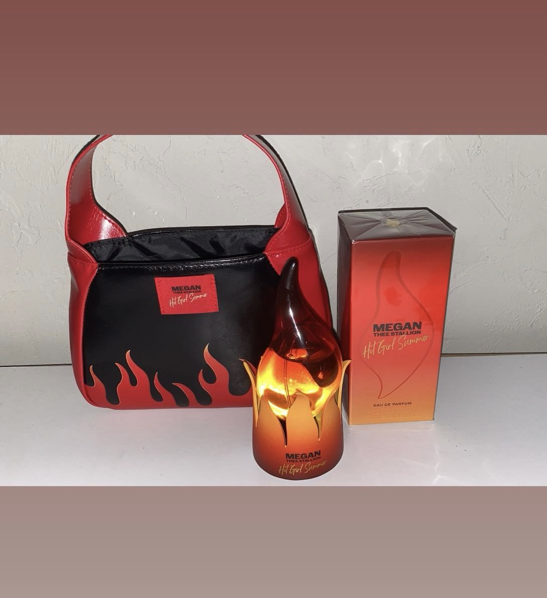 BRocka211's tweet photo. Megan’s perfume, bag and holder are so cute together!😍😍😍😍 Had to buy another one for the purse and holder🔥🔥🔥 #megantheestallion https://t.co/mI5PXFmmx4