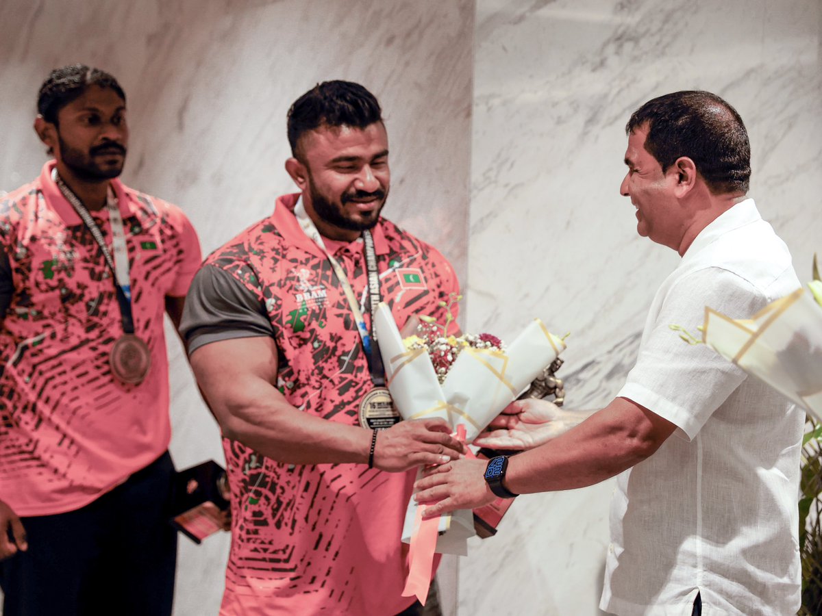 MoYSF_mv's tweet photo. State Minister Ibrahim Amir welcomed the Maldives National Bodybuilding Team upon their return from the 16th South Asian Bodybuilding and Physique Sports Championship 2026, held in Thimphu, Kingdom of Bhutan, from 30 June to 5 July 2026.

The Maldivian team delivered an outstanding performance on the regional stage, bringing home three medals:
🥇 Azneen Rashad – Gold Medal and South Asian Champion in the Men's Athletic Physique (Up to 167 cm + 4 kg) category.
🥈 Ahmed Naeem – Silver Medal in the Men's Sports Physique (Up to 170 cm - 2 kg) category.
🥈 Ali Mabrook Latheef – Silver Medal in the Men's Sports Physique (Up to 175 cm) category.