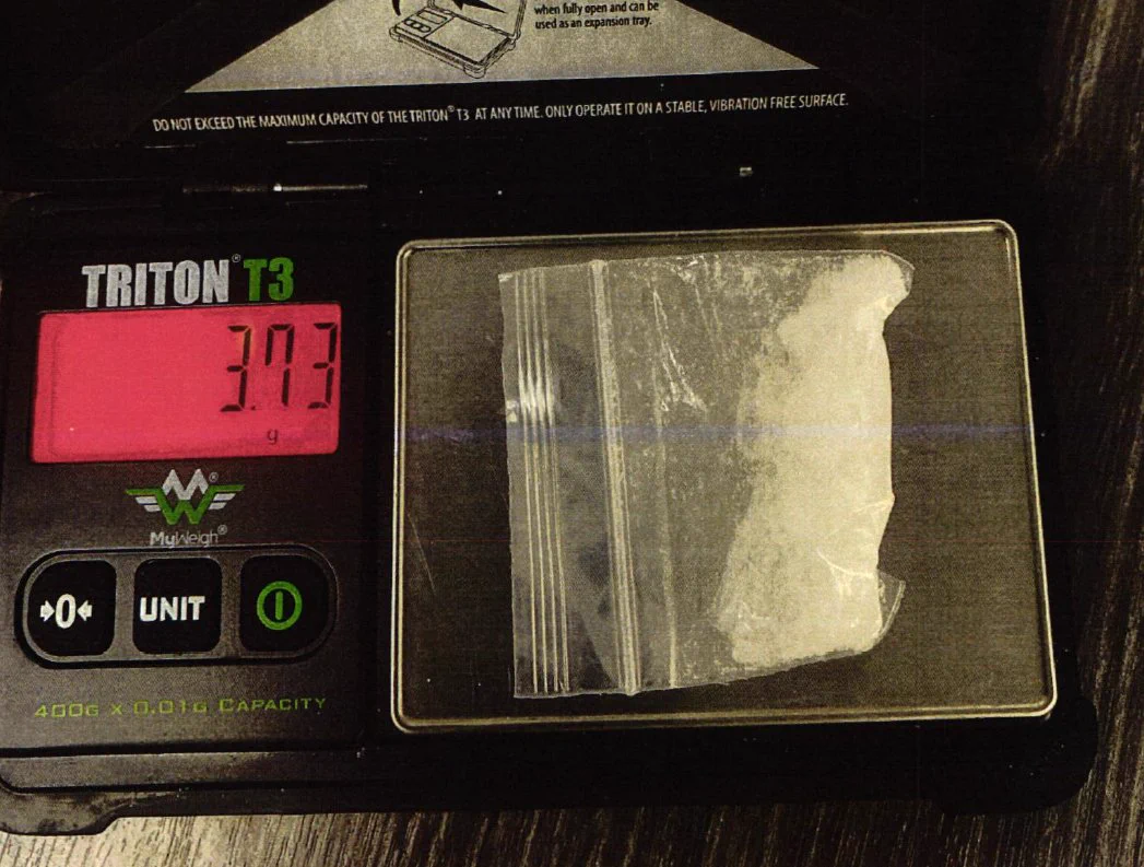 Methamphetamine in a small plastic bag sitting on a scale