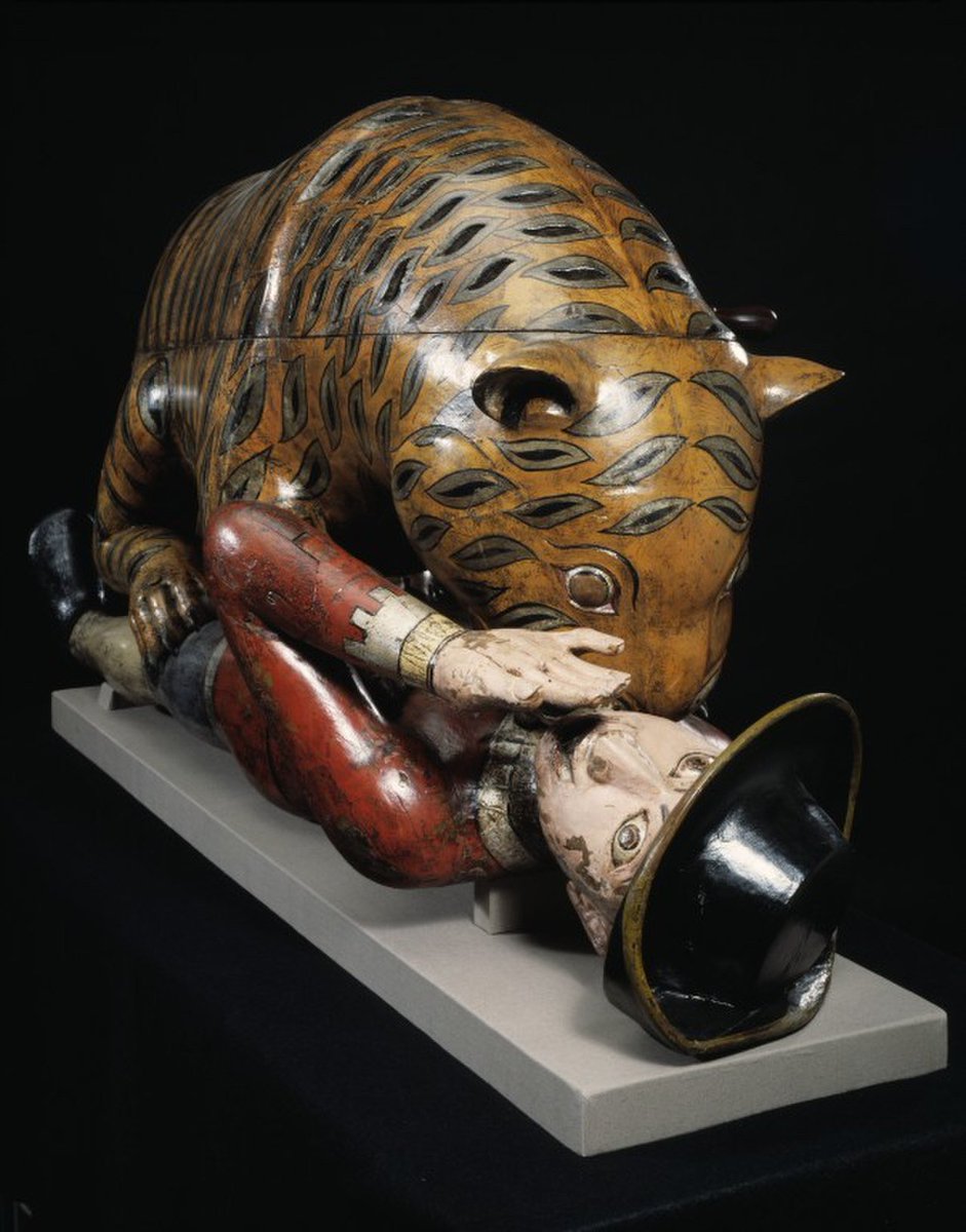HQuarterma43504's tweet photo. Built in 1790, Tipoo's Tiger is a life sized Indian toy showing a Bengal tiger eating a British soldier. The machination features mechanism that causes the English soldier to flail his arms and an automated 18-note keyboard pipe organ that plays the sound of a scream. https://t.co/D2gDgtH2ZN