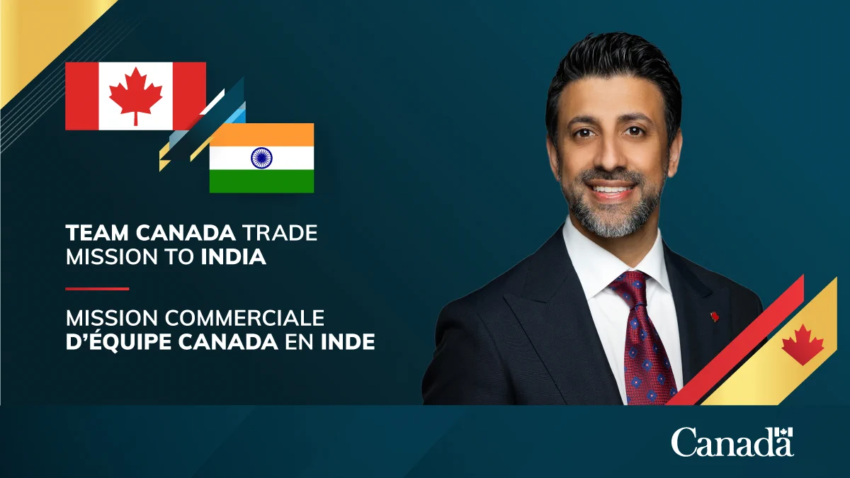  An infographic with the Canadian and Indian flags in the top-left corner. Minister Sidhu’s official headshot is to the right of the flags. The English text on the infographic reads: “Team Canada Trade Mission to India.”  The Canada wordmark is in the bottom-right corner. 