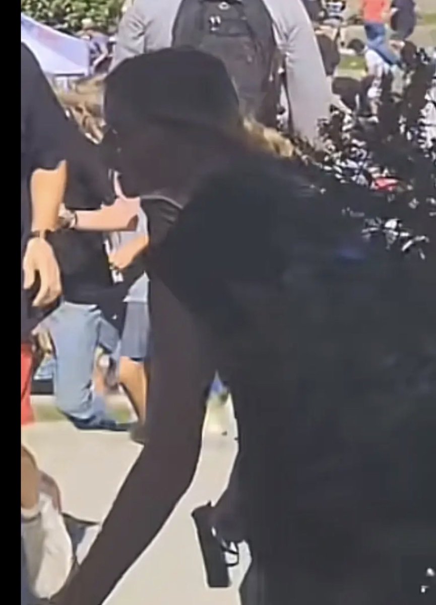 WhatTheFekete's tweet photo. Is that a gun?  Looks like a gun.  Screenshots someone sent me from a video someone took that day. IS that a gun?  

#charlirkirk #erikakirk #tpusa #turningpoint https://t.co/ZcVxKU9m3g