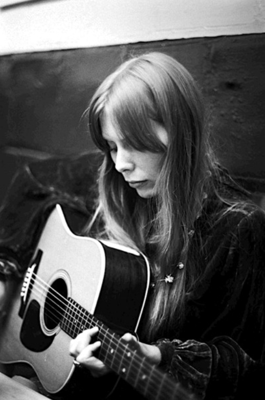 jonimitchell's tweet photo. Strumming away backstage at the Uncola Festival 57 years ago today.

Photo by Joel Bernstein https://t.co/9RA1T1xCnl