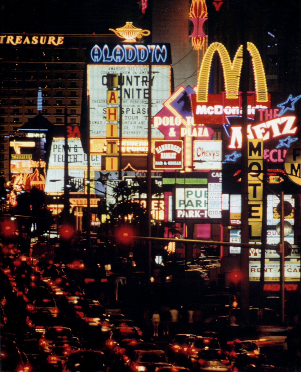 summacorp's tweet photo. Las Vegas Strip, summer 1995. 

Unknown photographer with telephoto lens on a pedestrian bridge at Tropicana Ave, facing north. https://t.co/Y98f6r3tQR