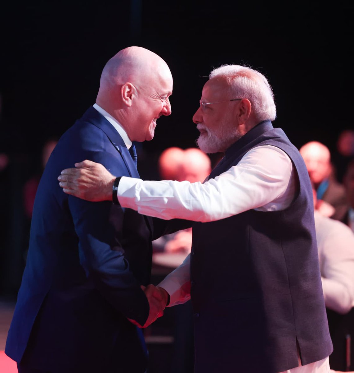 PMOIndia's tweet photo. PM @narendramodi participated in the India-New Zealand Business Event in Auckland with PM @chrisluxonmp. He highlighted India's emergence as a global growth engine and discussed opportunities in sectors such as technology, talent mobility, services, food processing, FinTech, space and infrastructure.