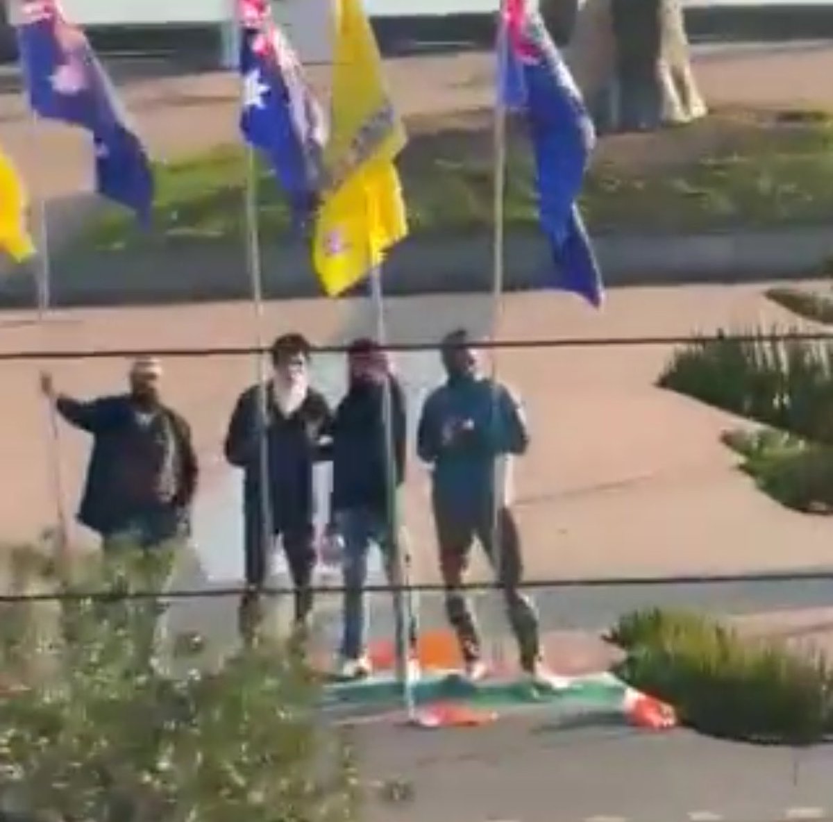 FabulasGuy's tweet photo. These protesters disrespecting Indian
Flag.

Well done Australia for what? 

These pappu fan can go any extent in hate towards Modi. https://t.co/tkCo38DK3g