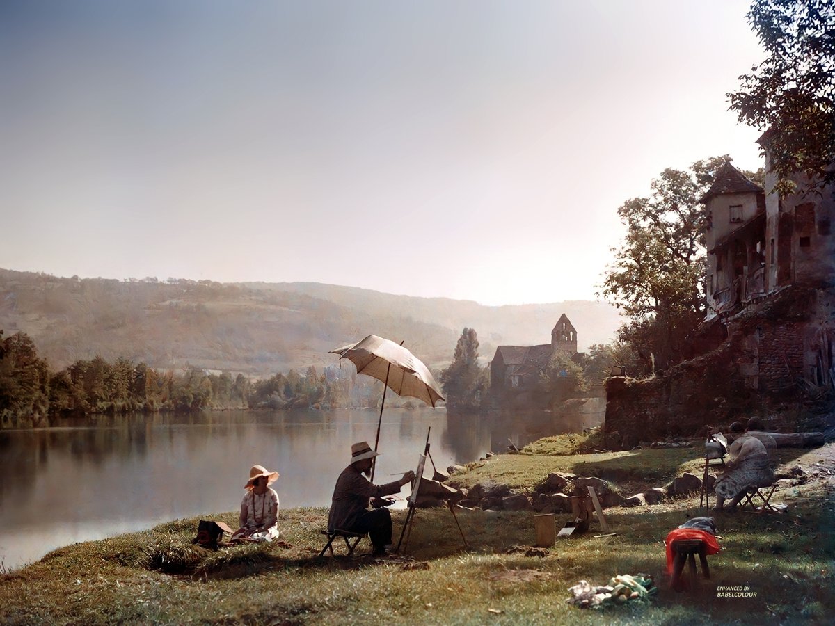 StuartHumphryes's tweet photo. On such a beautiful day like today my mind is drawn back to one of the most beautiful autochromes ever taken: a study of artists on the banks of the Dordogne at Beaulieu in France 101 years ago. The light, the colour & the composition are works of art in itself! 
I have cleaned up this stunning photographic plate showing an artist at his easel being painted in turn by a woman at hers. In the distance is the St Pierre Abbey church. It captures a moment of true serenity and beauty.
You will notice, because of the long exposure time required by Autochromes, that the female painter has become a double-exposed through motion blur. It was taken in colour Jules Gervais-Courtellemont in 1925 using an early colour glass-plate process and isn't colourised. It remains one of my favourite works.